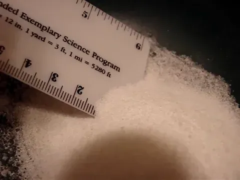 Water being poured into sugar.