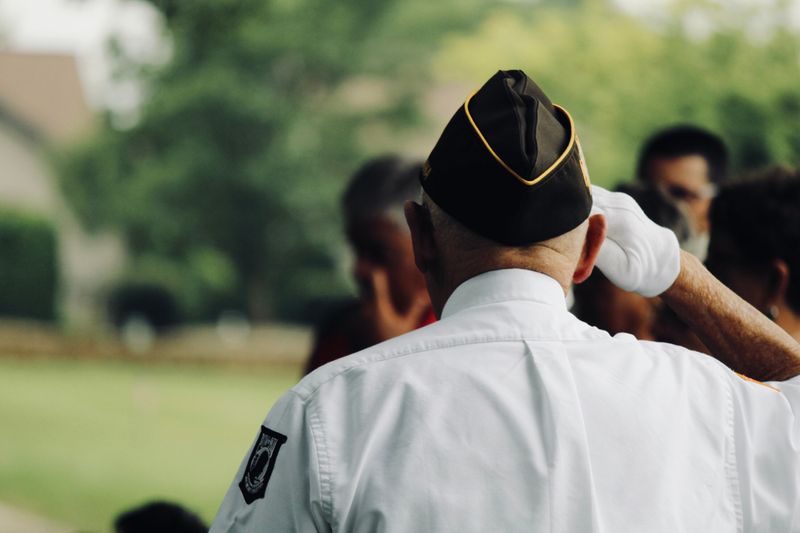 veteran from behind, saluting 