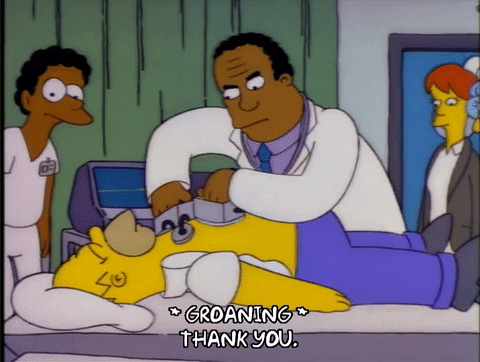 Bart Simpson on bed and doctor using defibrillator. 