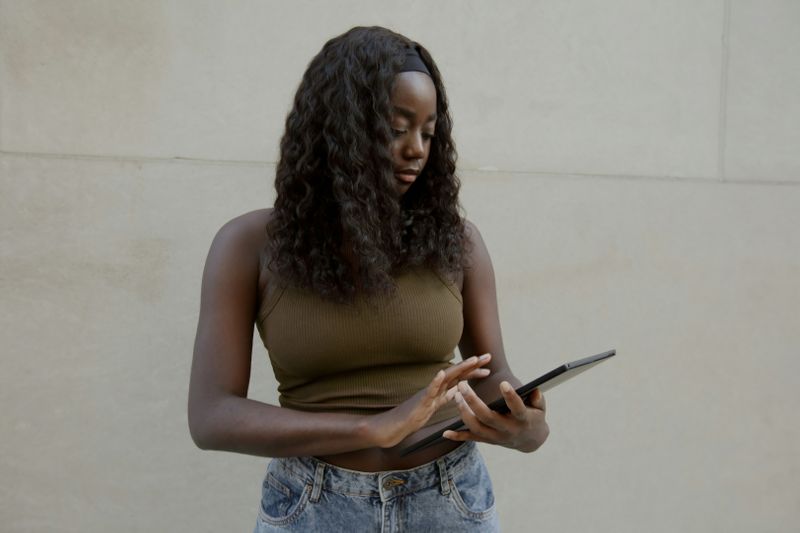 A woman using her tablet.