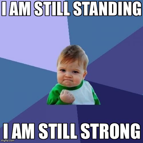 A determined baby says: 'I am still standing I am still strong.'