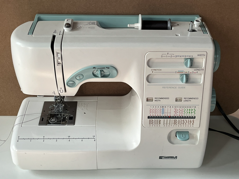 Photograph of a  basic mechanical sewing machine.