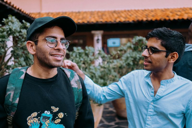 Two friends talk to each other.