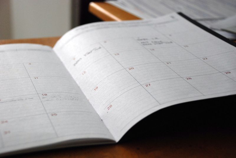 An open notebook with a calendar.