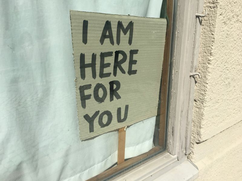 A sign in a window that reads: 