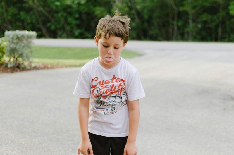 Child sticking his tongue out.