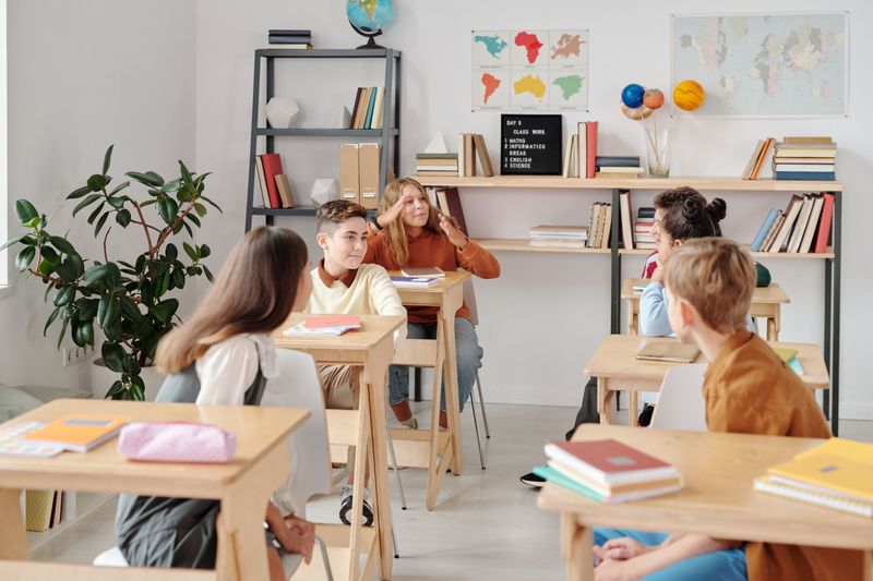 Students participating actively in a classroom setting, fostering education and interaction.