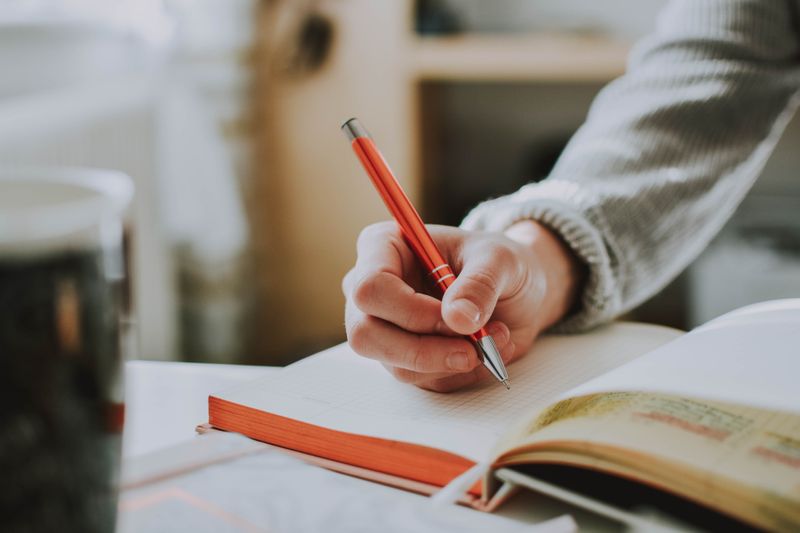 Person writing in a journal