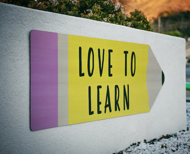 A mural depicting a large pencil with the words 