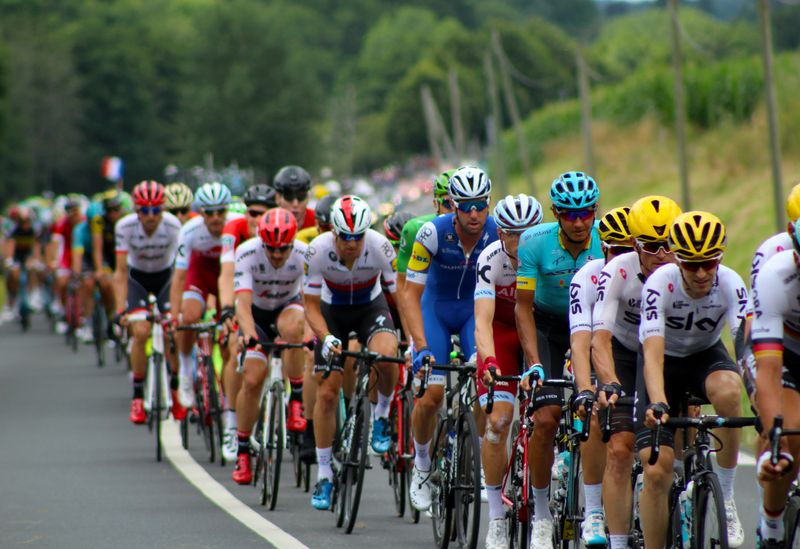 Cyclists riding in a long row.