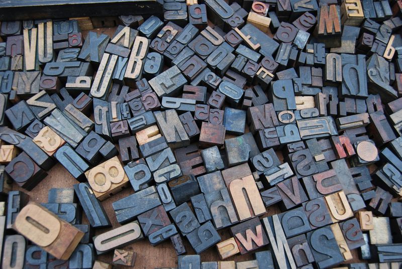 A pile of letter keys for a printing press.