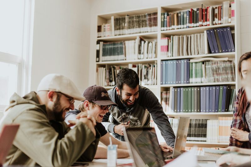 A group of people studying together at a table.