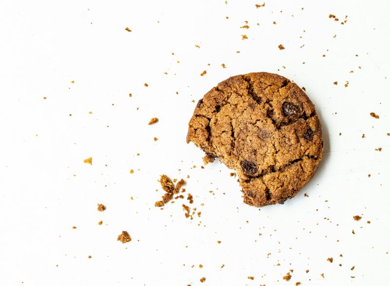 A cookie that has a bite taken out of it. 