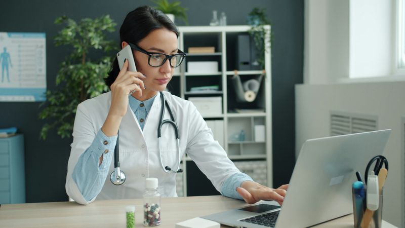 Doctor making a call to a patient