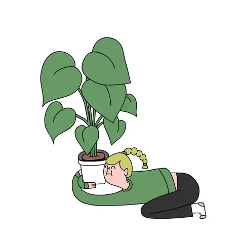 A girl hugging a potted plant.