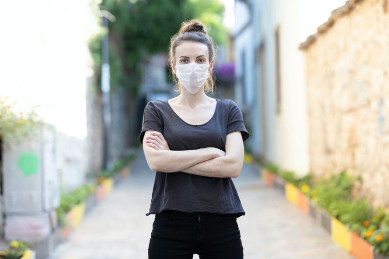 assertive masked woman