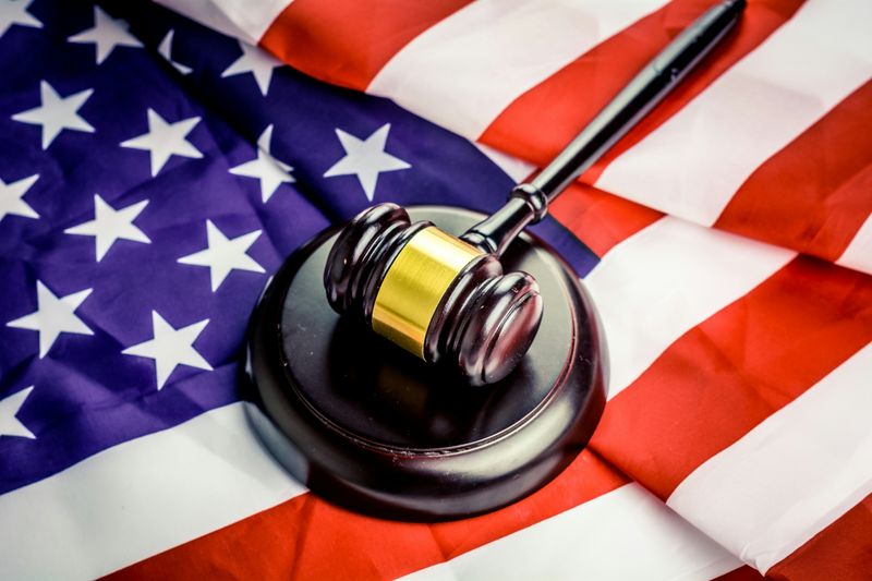 A gavel rests atop a US flag.