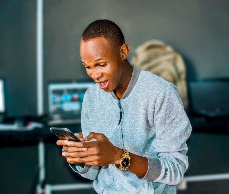 A man surprised while texting.