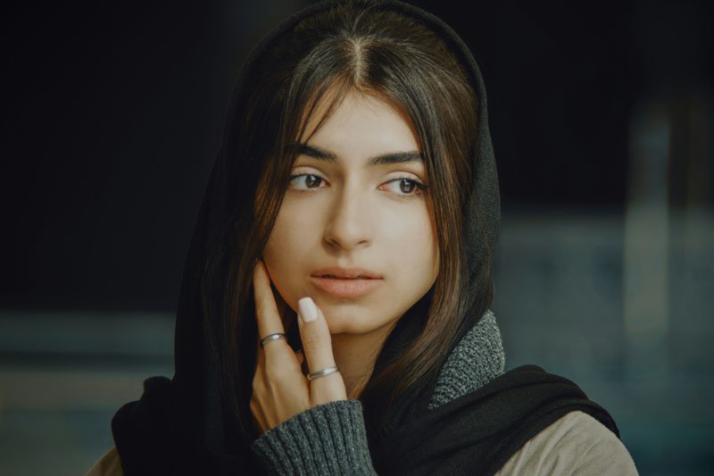 A young woman in deep thought.