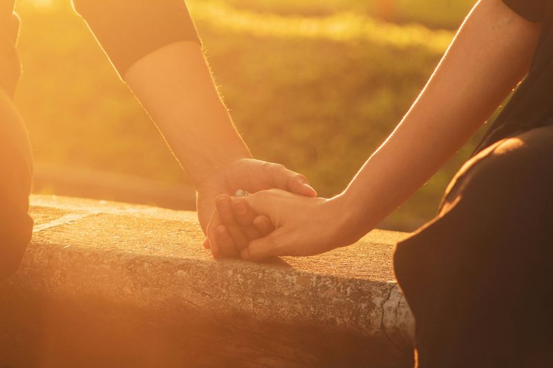A couple holding hands.