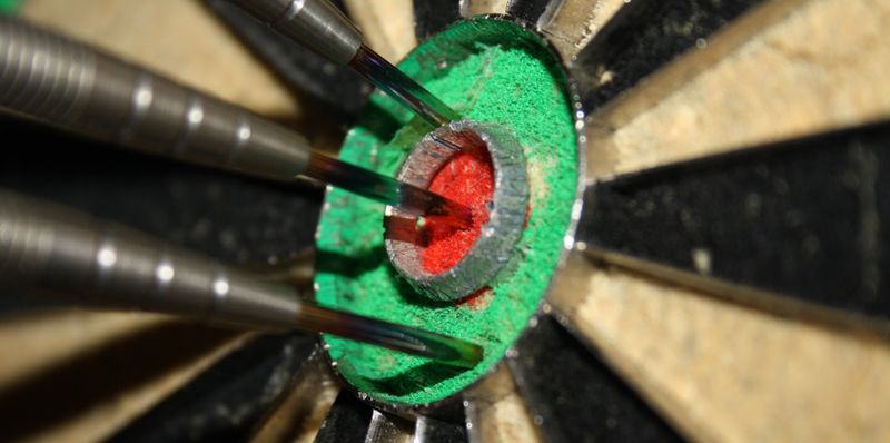 A dart hitting a bullseye.