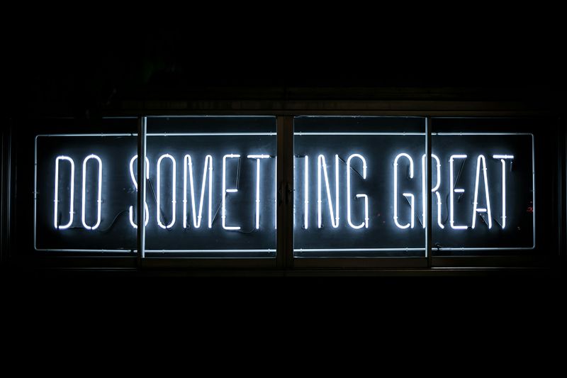 A neon sign that reads, 'Do something great'