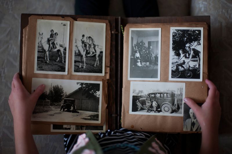 Person looking through a photo album.