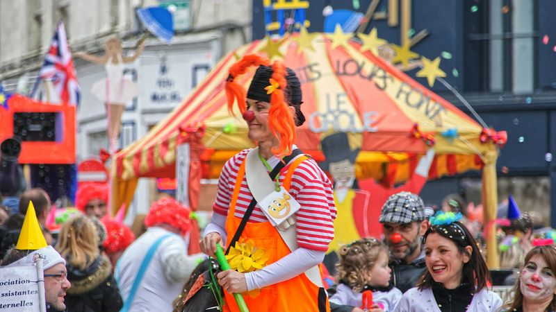 A clown performing at a fair.