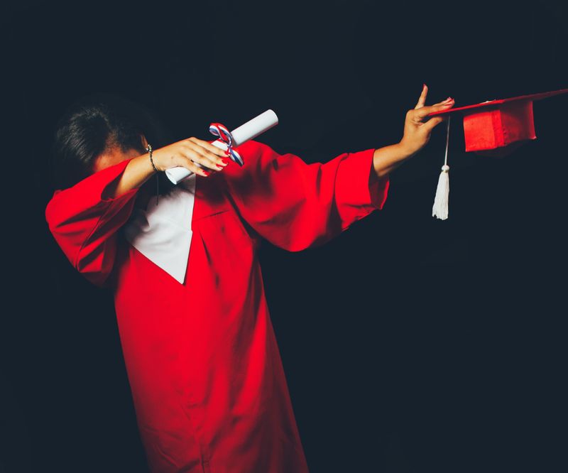 a high school student in graduation attire