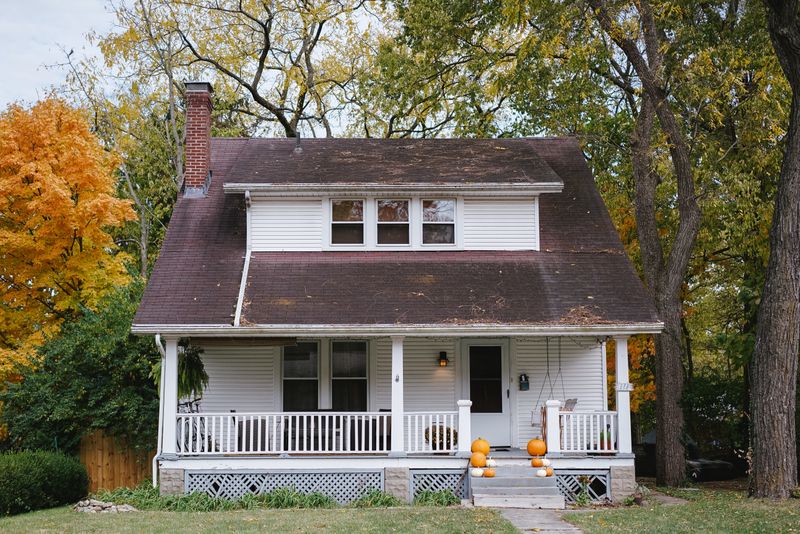Small single family home with covered front porch.