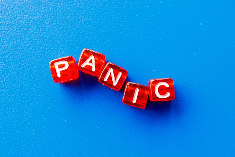 The word panic spelled out with red letter cubes