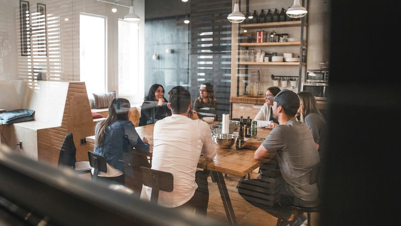 A group of colleagues sitting around a table.