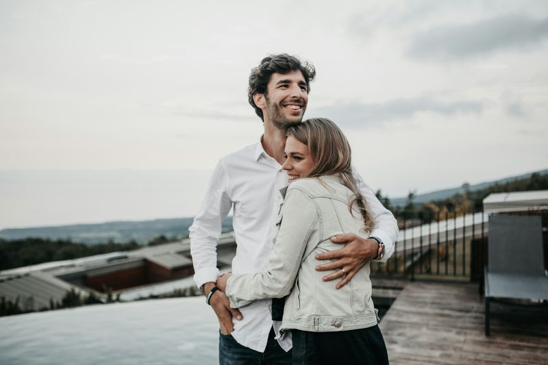 Two people hugging each other.