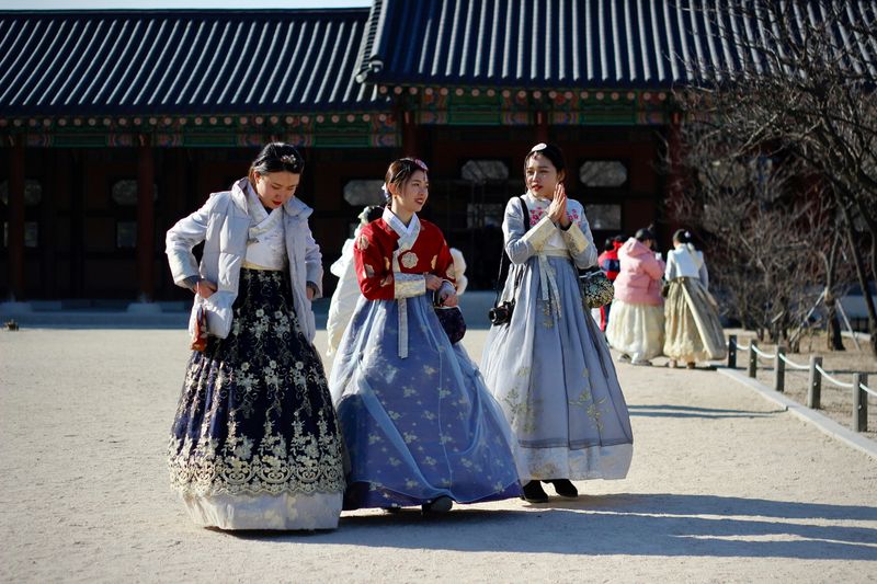 3 women wearing hanbok, which is a Korean traditional clothing.