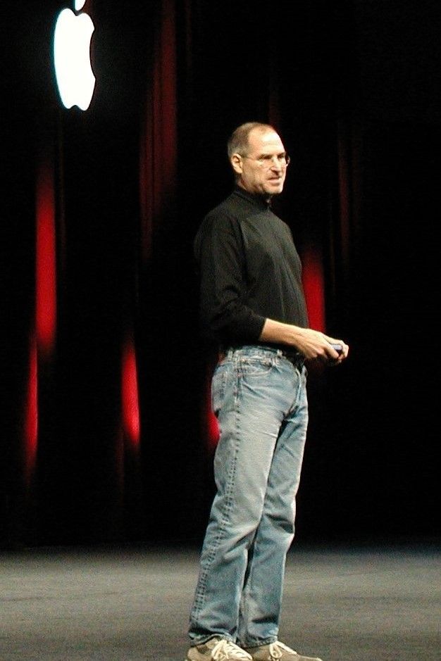 Steve Jobs presenting on a stage.