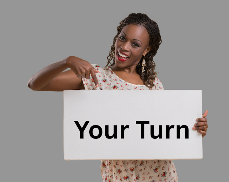 A woman holding a sign with words 