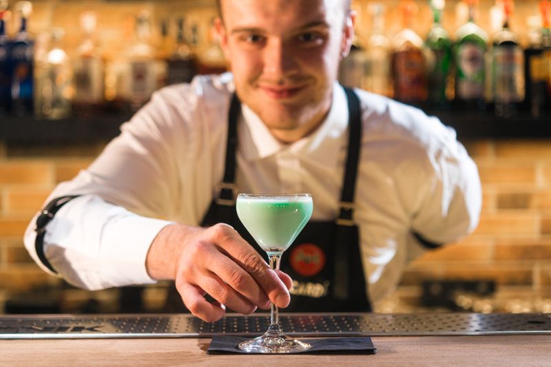 Bartender giving a drink