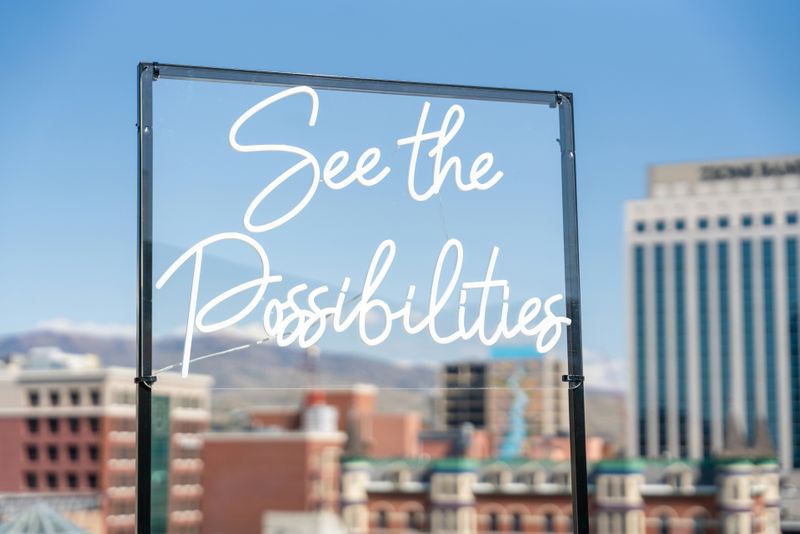 Neon lettering on glass that “See the possibilities