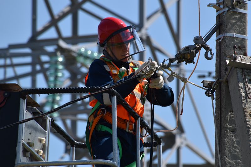 Electrician working on a powerline