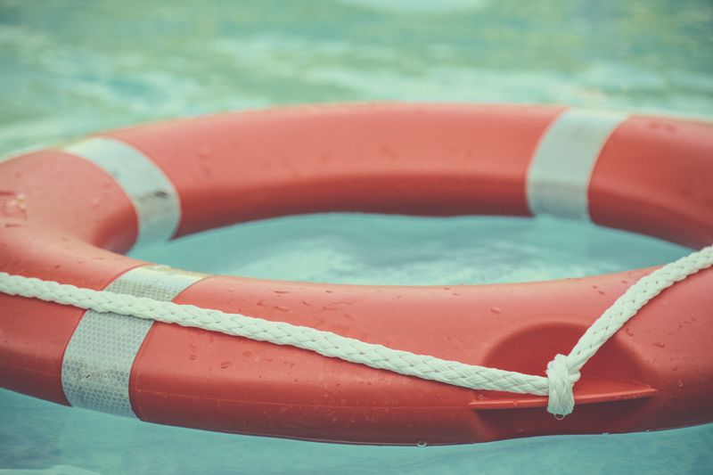 An orange life preserver in water