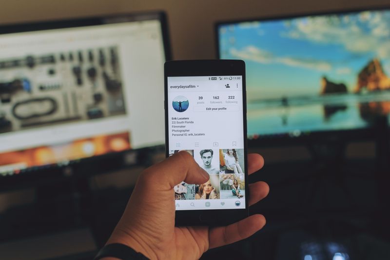 A Smartphone with the edit your profile screen visible.