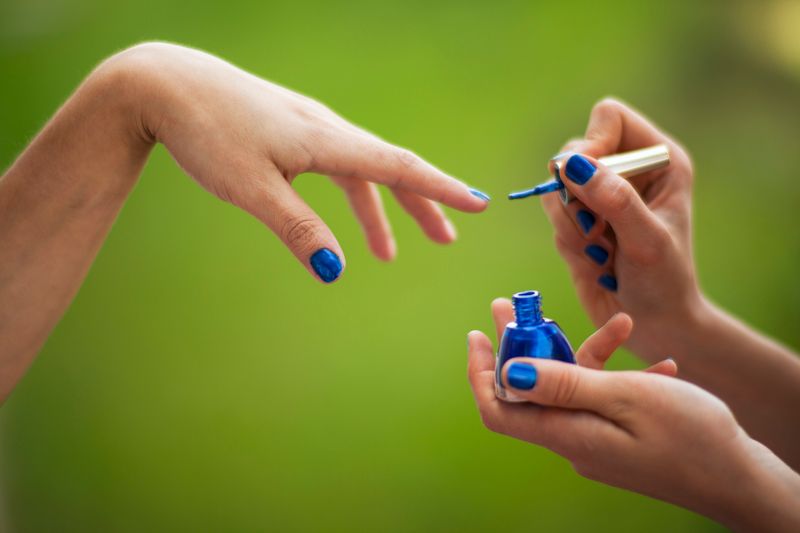 Painting nails.