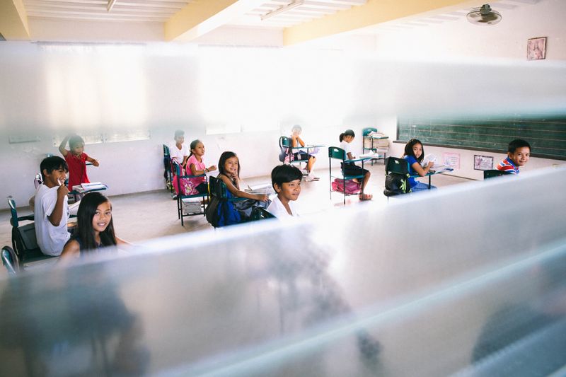 A classroom full of international students waiting for the teacher.