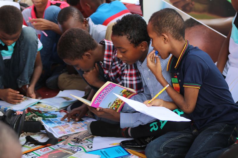 A group of school children reading