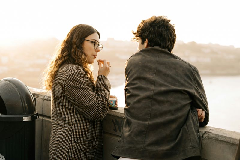 Two people in conversation — one leaning in, fully engaged
