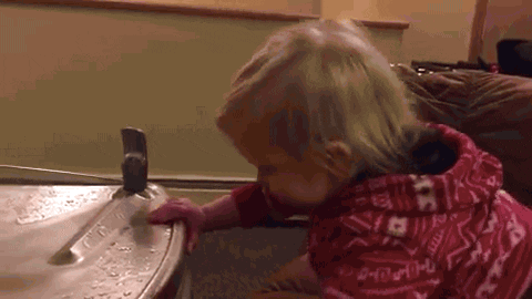 GIF of a child unable to drink from a water fountain.