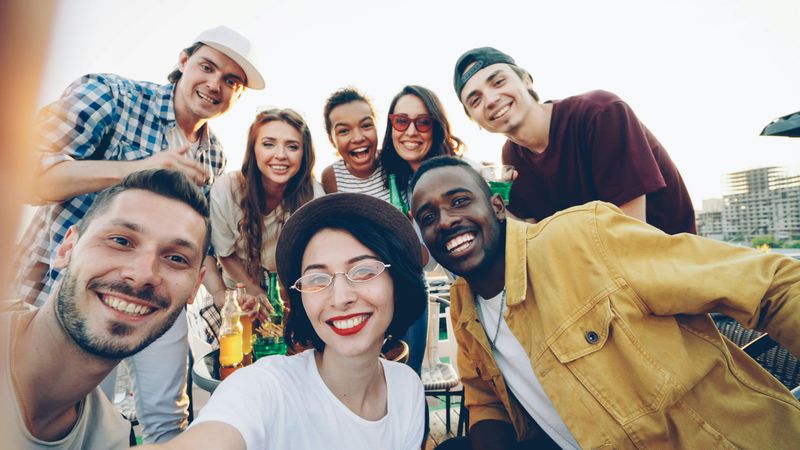 A multicultural team posing for a group photo.