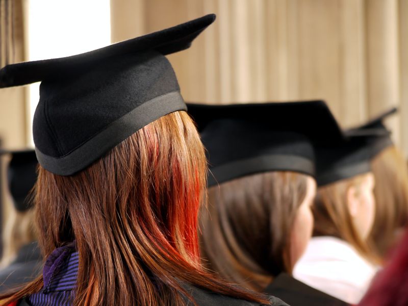 Back of students' with graduation caps heads