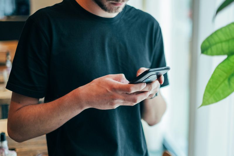 A man texting.