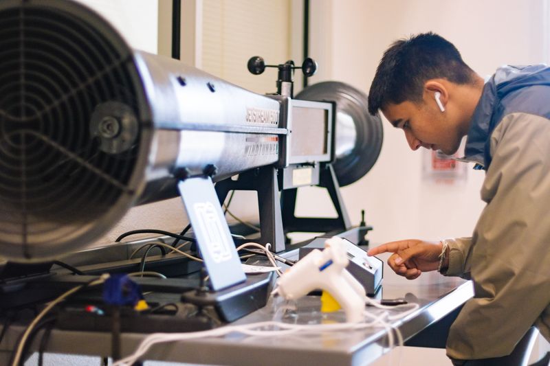 student using lab equipment for school